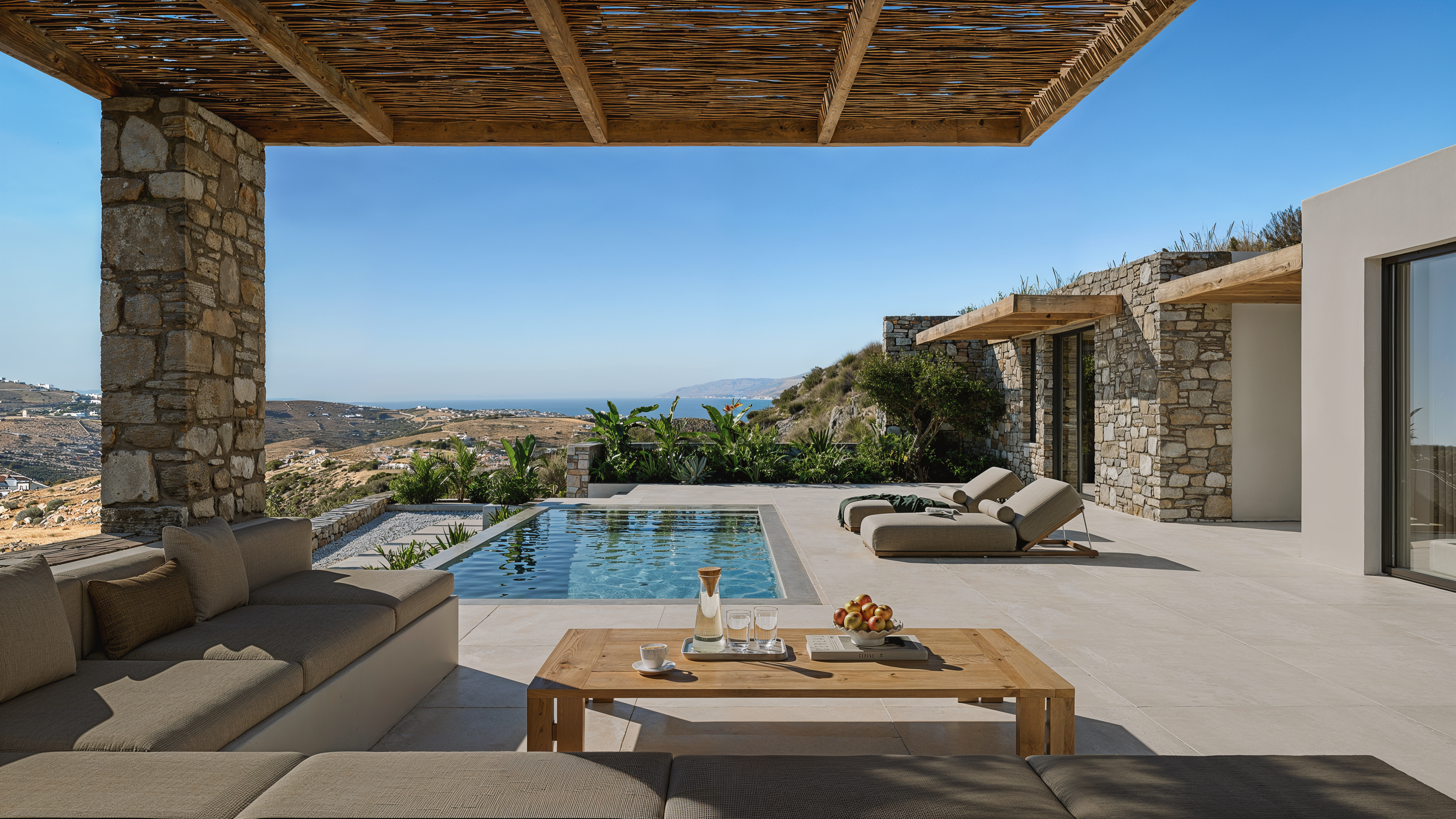Private pool and unique outside lounge at Villa THEORS in Paros Greece overlooking the Lefkes-Kostos valley and the Aegean Sea.