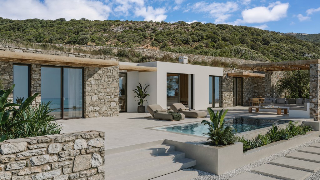 Exterior of Villa THEROS in Paros Greece, built with natural Parian stone excavated from the property, featuring a private pool and contemporary architecture.